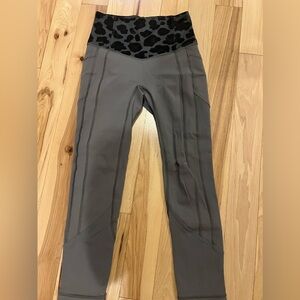 Lululemon grey w/black leopard print waist leggings. Size 4